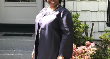 Woman in graduation cap and gown