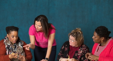 Women working with STEM Education items