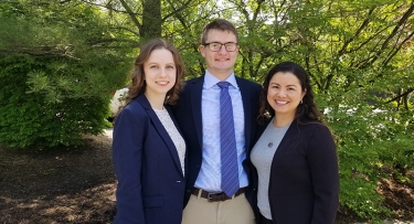 Accounting students in suits on campus