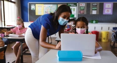 Teacher and student in classroom