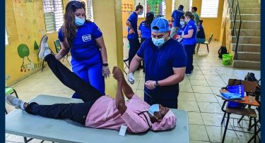 Photo of students with patient