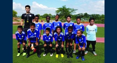 Mercy student with soccer team