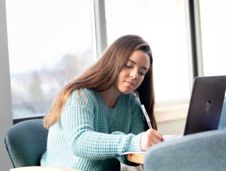 Student on computer in library