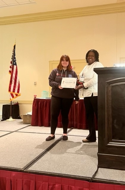 Student getting recognition at conference